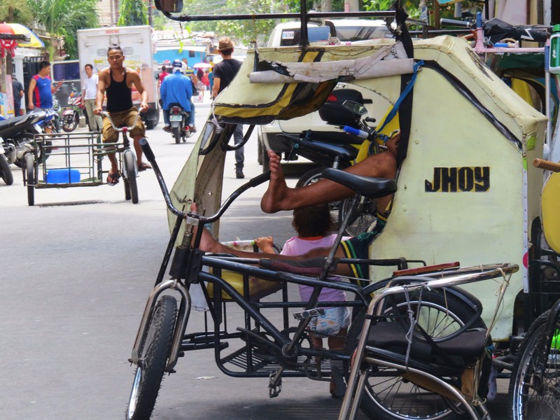 Many trishaw drivers in Manila
