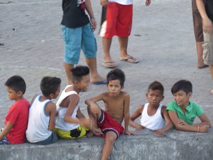 Children at a basketball game in Manila