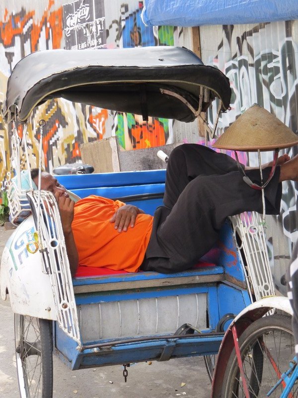 Tricycle driver taking a nap