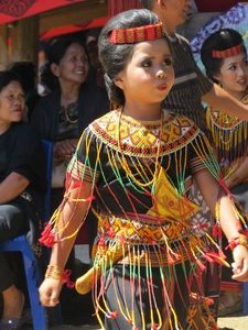 Young girl in traditional dress at the funeral