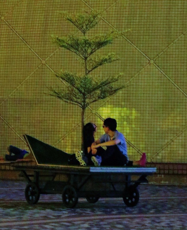 Couple relaxing by the promenade