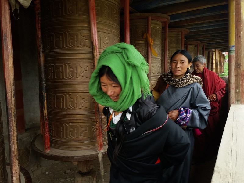 Locals walking the kora spinning the prayer wheels as they go