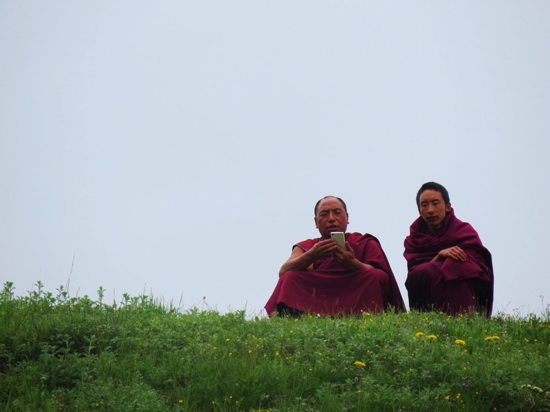 A couple of monks taking a rest on the hill