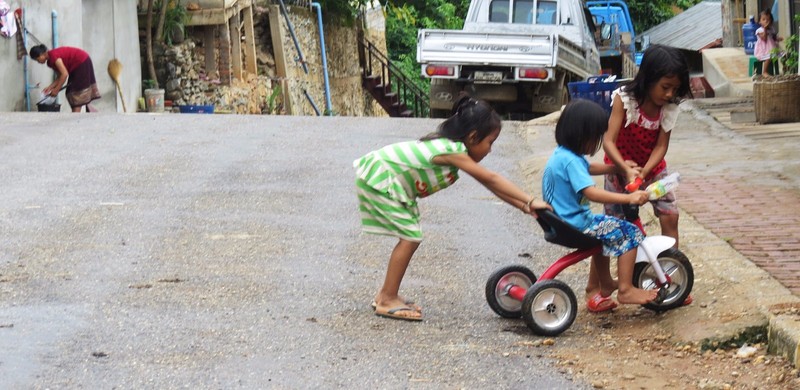 Children enjoying a tricycle ride