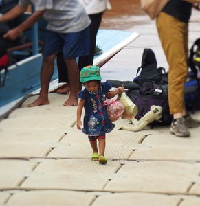 Young girl helping to unload the boat