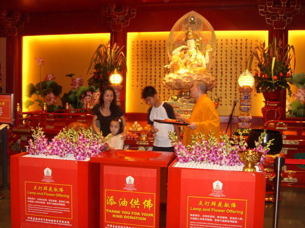 Monks Conducting a Lamp and Flower Offering
