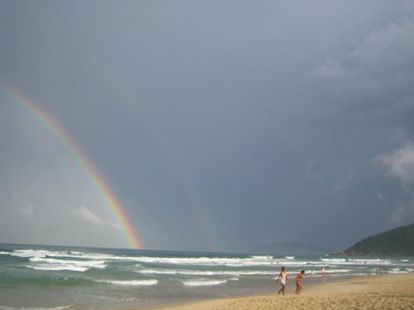 ...but then the sun comes out and a rainbow breaks over the ocean!