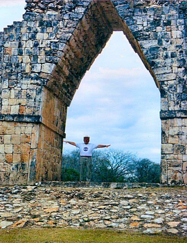 Dave is dwarfed by Kabah's arch at the end of the sacbe (Mayan roadway) that runs 18 km to Uxmal.