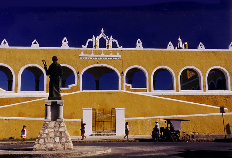 Bishop Landa and entrance to the enormous Izamal convent courtyard built over destroyed Mayan pyramid