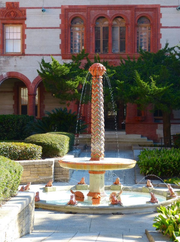 Approaching the entrance we see a fountain representing the hilt and hand-guard of a sword protruding from a fountain with twelve frogs forming a sundial.