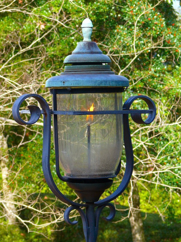 Gas lanterns add a touch of genteel charm to the garden and entrance.