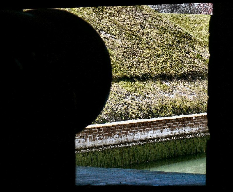 view through a cannon port placed at ground level, so as to fire upon invading enemy soldiers