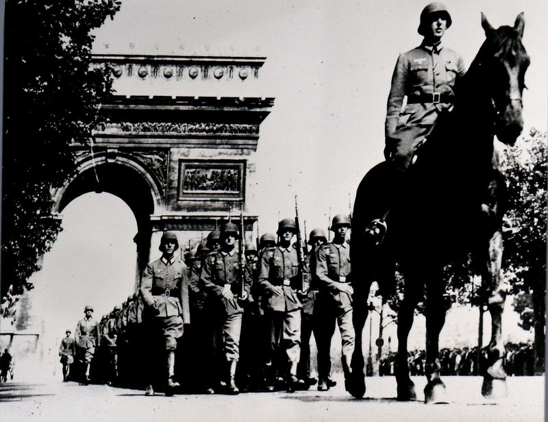 Hitler's troops marching through Paris' Arc de Triomphe in 1940.