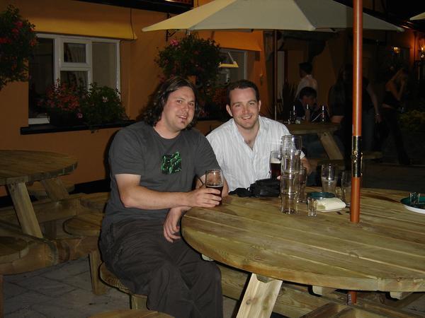 chris and lenon enjoying a pint