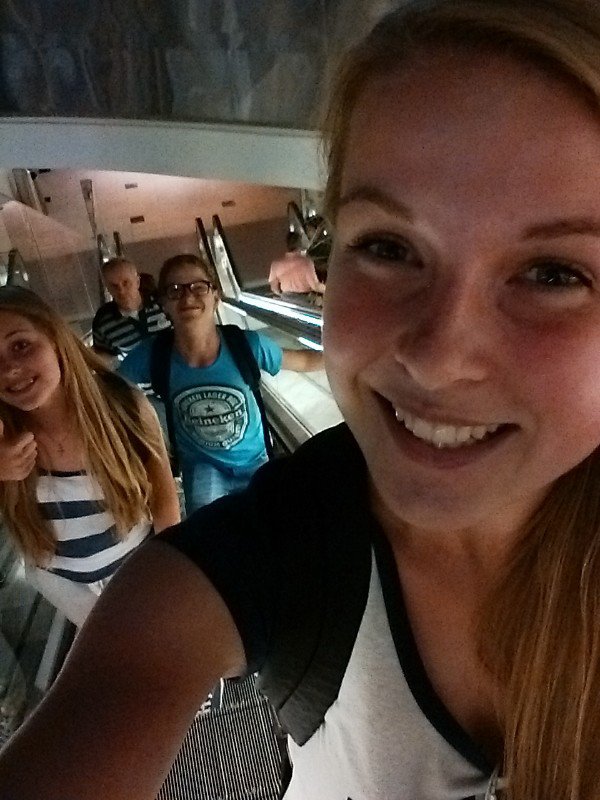 Escalator selfie with brother and sis