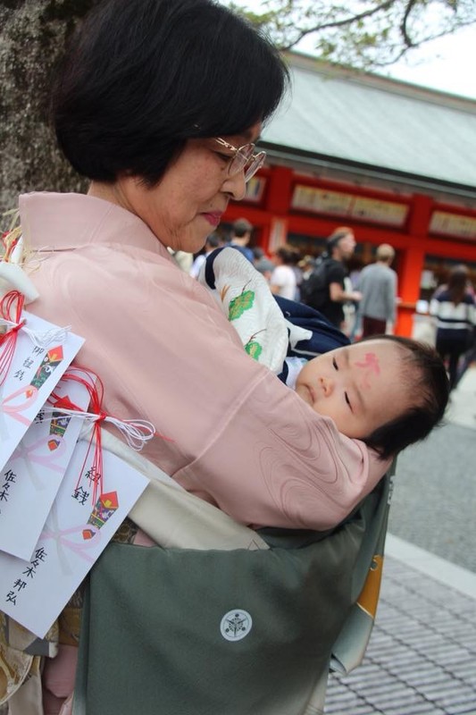 Baby brought for first shrine visit