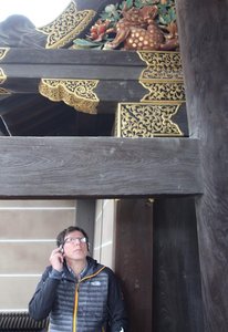 Danny listening to the audio guide and checking out the architecture at the entrance gate to Ninomaru Palace