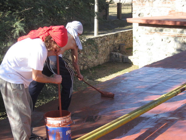 Painting the roof of the orphanage
