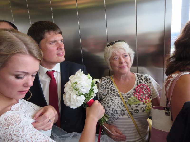 Riding the elevator with the bride and groom