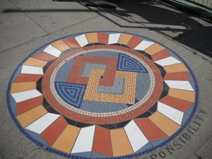 “Community” sidewalk mosaic medallion