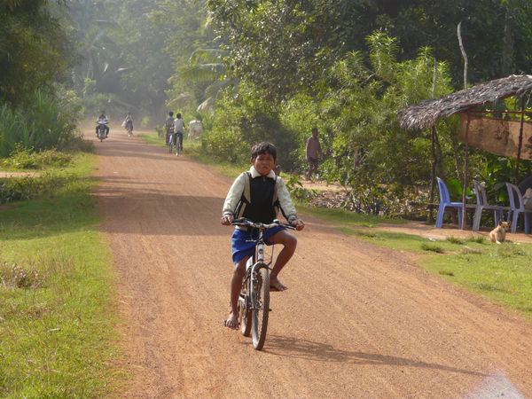 Cycling in the countryside near Roluos