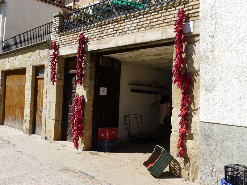 Drying Peppers In The Main Street 