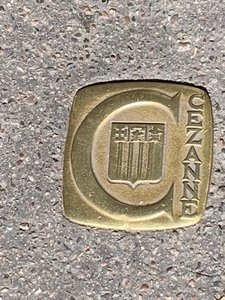 Bronze Cezanne Marker Plates Are On Footpaths All Around Town 