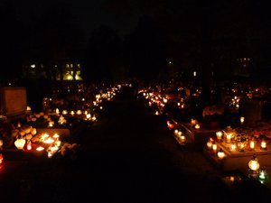 Candles throughout the cemetery.
