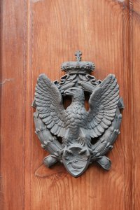 Door knocker on Italian AP Headquarters.
