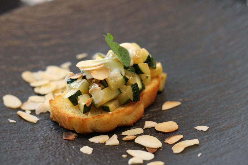 Roasted zucchini, cottage cheese with pumpkin and sunflower seeds and honey