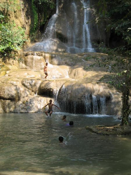 waterfall and local kids