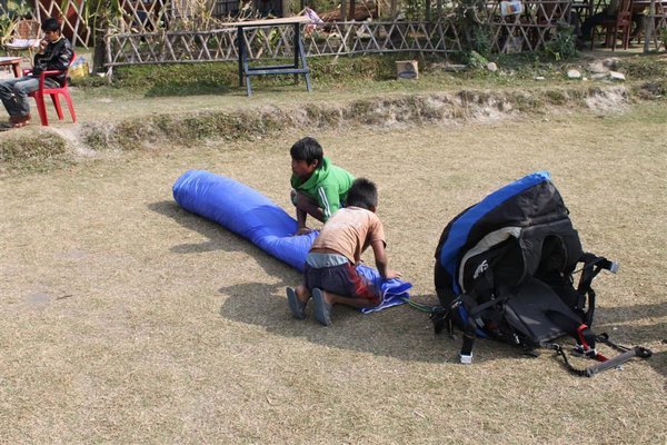 Kids folding up the parachute