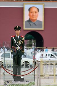 Guard and Mao watching over Tiananmen Square
