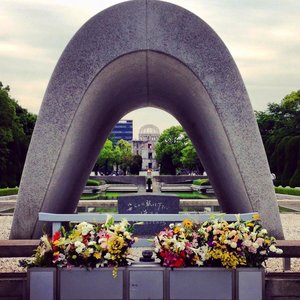 Hiroshima Peace Park - the peace flame glowing in the middle and the empty shell of the building upon which the atomic bomb was dropped 