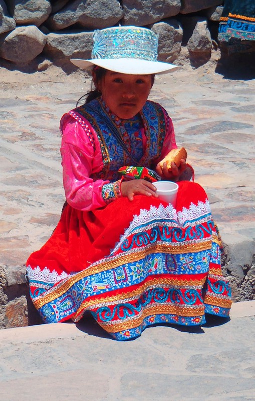 A local girl in traditional dress in Colca Canyon
