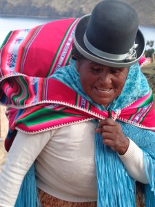 A local Aymara woman in carrying a heavy load