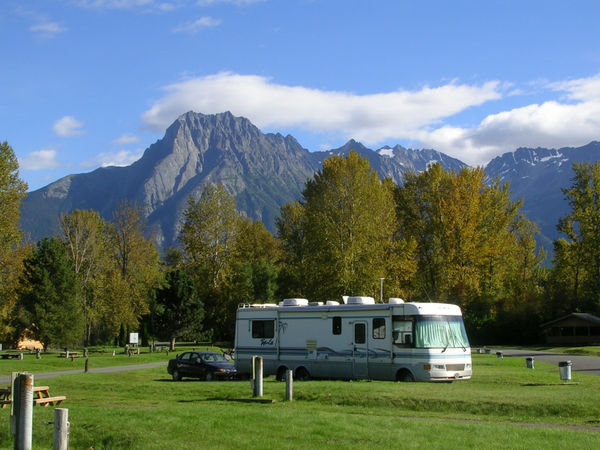 RV surrounded by mountains at 'Ksan Campground