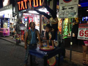 girl doing back bend attracts customers