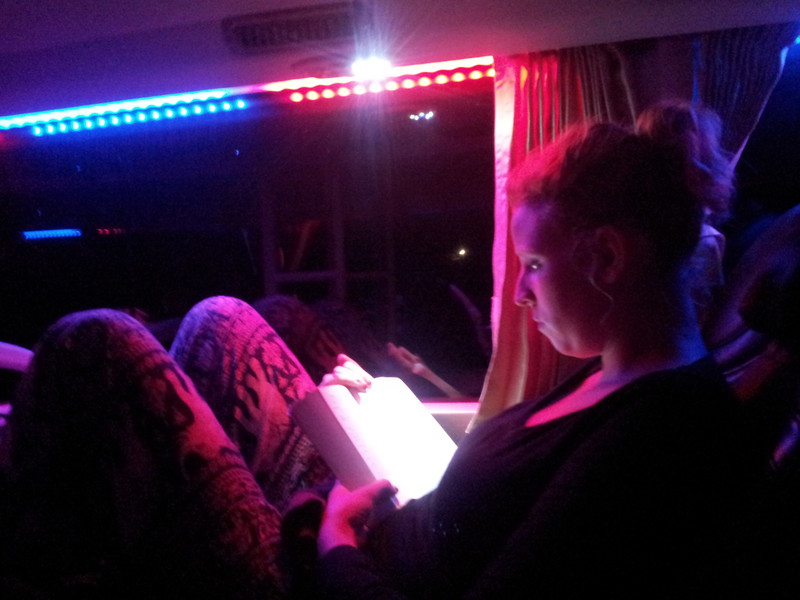 Hélène reading in the fancy sleeping bus