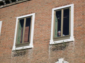 older man people watching from his window