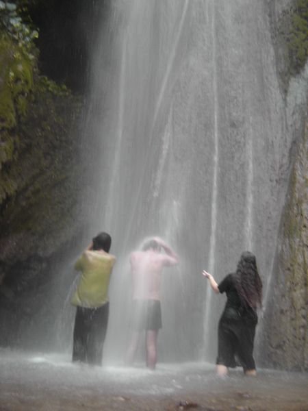 Taking a shower in a waterfall