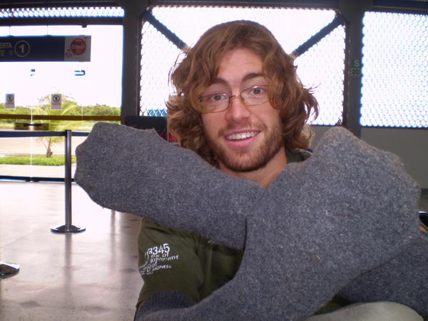 Simon in Puerto Maldonado airport (with socks on his hands)!
