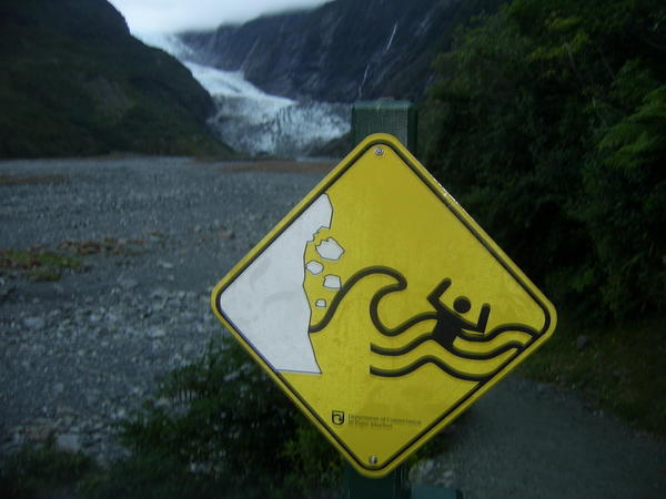Avalanche warning with Franz Joseph glacier in the background