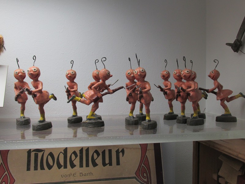 Old toys representing aliens. I'm unsure as to why they are carrying WW2 rifles and bayonets.