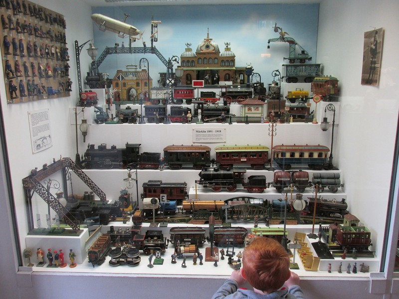 Part of the train collection with an interested observer.