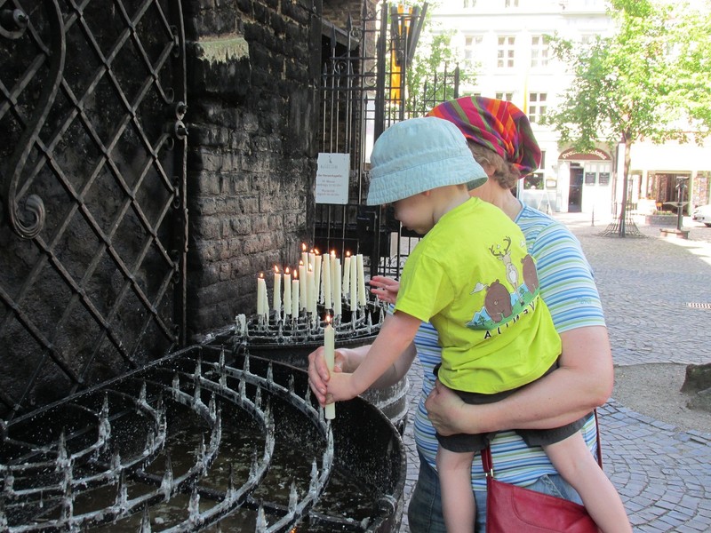 Zachary and Birgitta lighting a remembrance candle at Kevelaer.