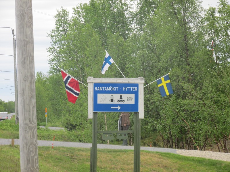 The three flags near the point where Norway, Finland, and Sweden meet.