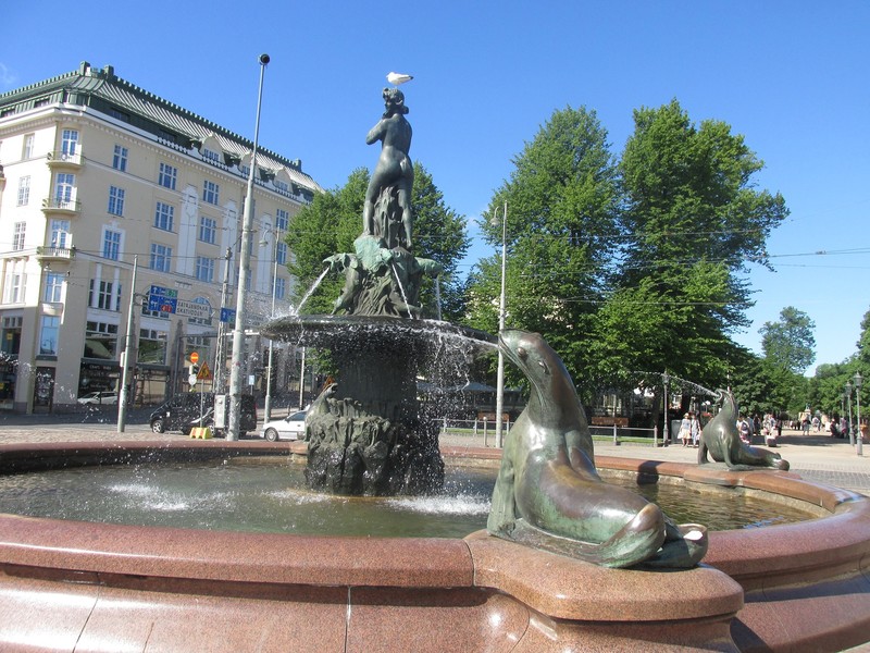 The female figure is known as the symbol of Helsinki. The seagull is obviously not impressed.