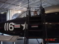 Me in the cockpit of a fighter jet in the hangar
