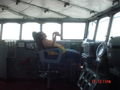 Sarah in the Captain's chair on the bridge